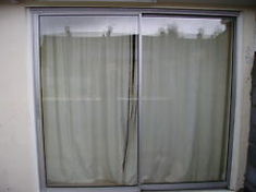 Patio door after glazed unit repairs leaving them clear again.